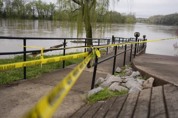 Caution tape is placed in MacGregor Park on the banks of the Cumberland River in Clarksville Tenn., Friday, April 4, 2025. (AP Photo/George Walker IV)