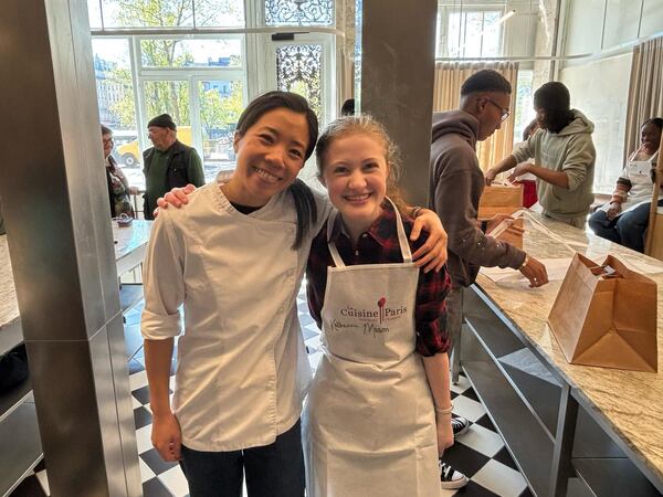 North Atlanta High School student Katherine Mason (right) poses with "Chef Vi," who taught the group of Atlanta Public Schools students how to make éclairs. (Katherine Mason)
