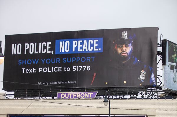 09/16/2020 - Atlanta, Georgia - A billboard promoting the need for police officers is displayed at the intersection of Peachtree Road NE and East Paces Ferry Road NE in AtlantaÕs Buckhead community, Wednesday, September 16, 2020. The billboard says it was paid for by Heritage Action for America. (Alyssa Pointer / Alyssa.Pointer@ajc.com)