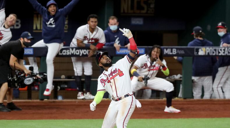 The Braves Marcell Ozuna strikes a pose for a make-believe selfie after his second home run of Thursday night against the Dodgers. (Curtis Compton/Atlanta Journal-Constitution/TNS)