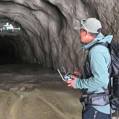 In this image provided by Manish Maharjan, filmmaker and drone pilot Manish Maharjan operates a drone at the entrance to a tunnel at the Rashuwaghadi hydropower project in Rasuwa district, Nepal, Monday, Aug. 31, 2026. (Manish Maharjan via AP)