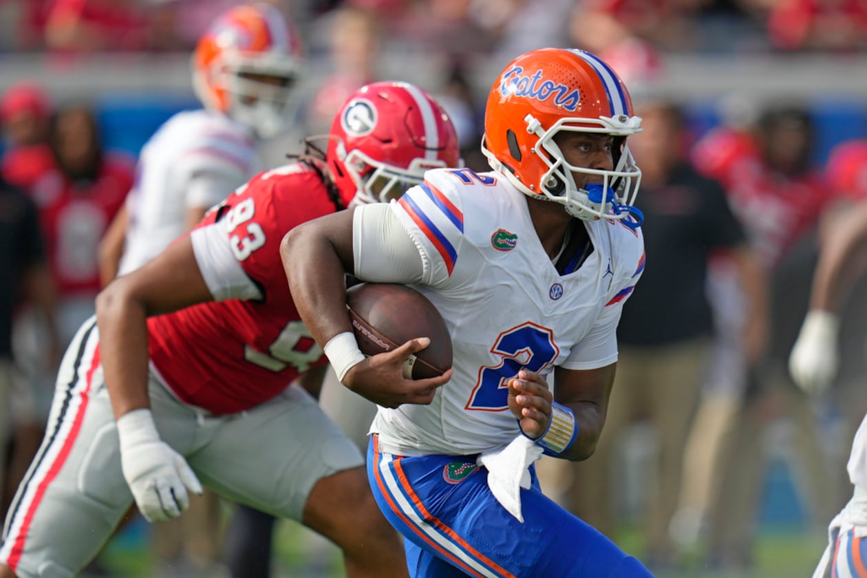 Florida quarterback DJ Lagway scrambles for yardage past Georgia defensive lineman Tyrion Ingram-Dawkins during the first half of last year's game. (John Raoux/AP)