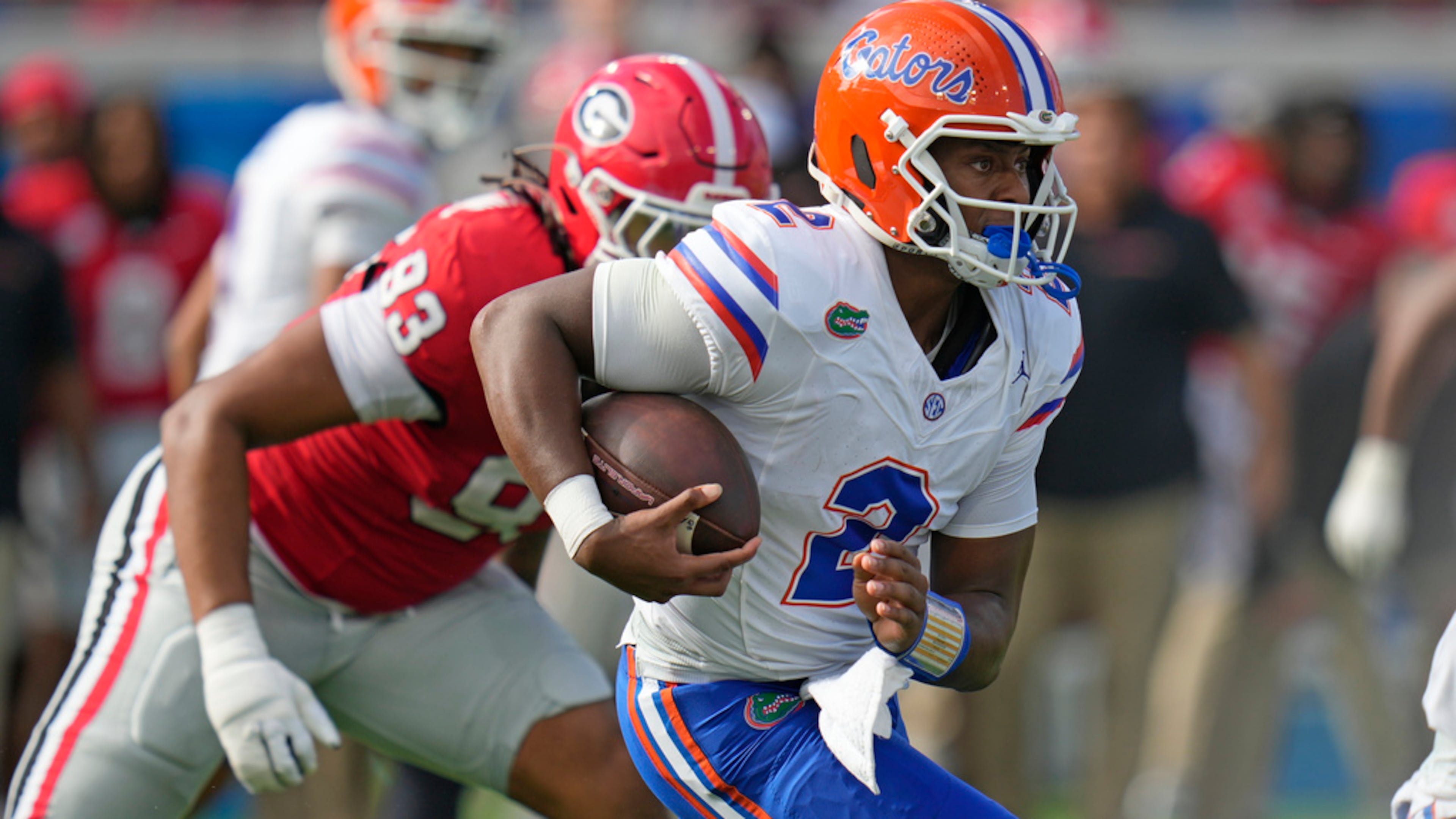 Florida quarterback DJ Lagway scrambles for yardage past Georgia defensive lineman Tyrion Ingram-Dawkins during the first half of last year's game. (John Raoux/AP)