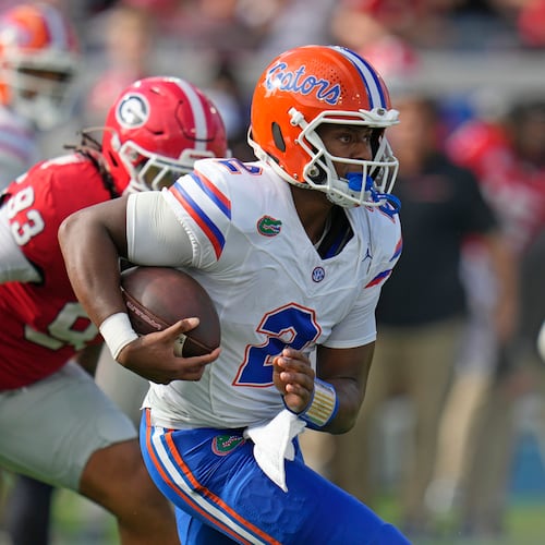 Florida quarterback DJ Lagway scrambles for yardage past Georgia defensive lineman Tyrion Ingram-Dawkins during the first half of last year's game. (John Raoux/AP)