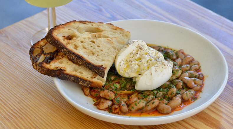 The burrata with cranberry beans at 8ARM, paired with The Last Word, a classic cocktail made with gin and green chartreuse.