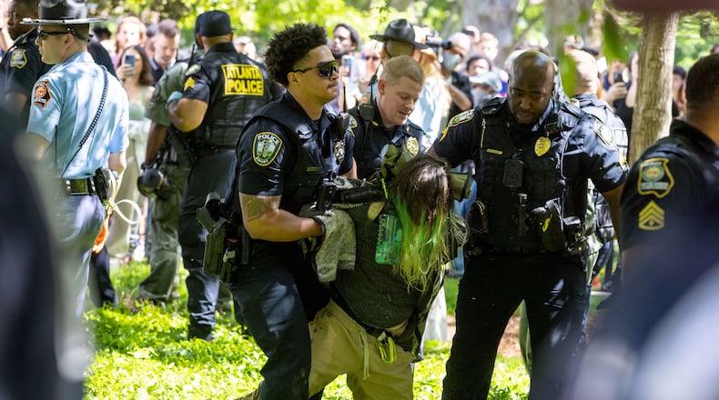 Police arrest pro-Palestinian protesters who set up an encampment at the Emory University campus in Atlanta on Thursday, April 25, 2024. (Arvin Temkar/The Atlanta Journal-Constitution/TNS)