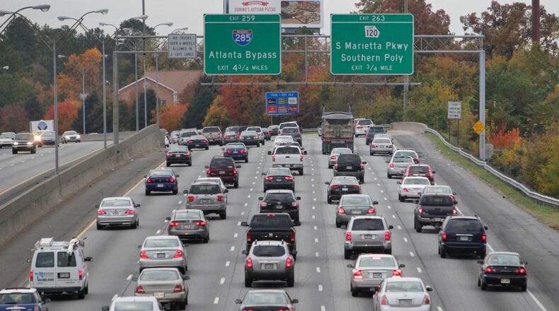 Brake lights flash during a morning commute on I-75 southbound just north of South Marietta Parkway.
