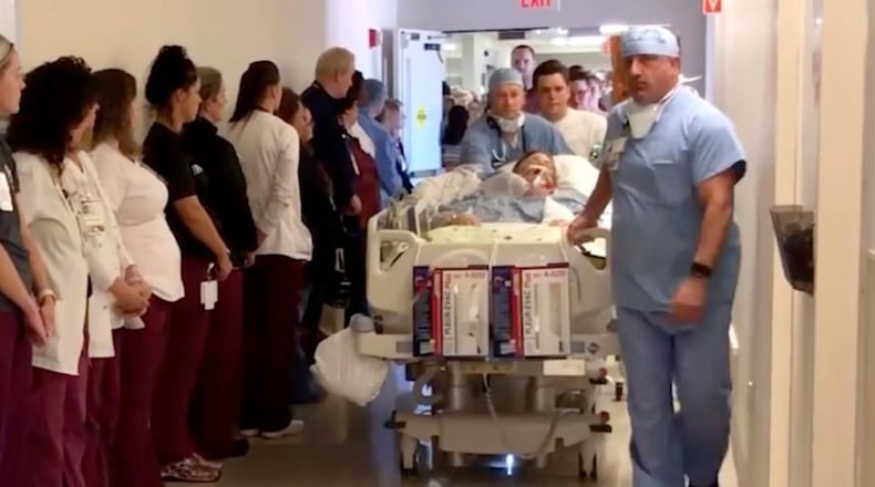 Screenshot of UPMC Hamlot video shows line of hospital employees honoring late nurse Mary Desin.