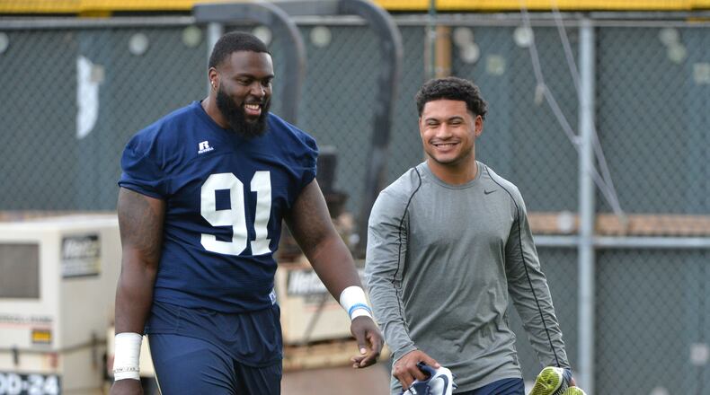 Georgia Tech Yellow Jackets defensive lineman Patrick Gamble (91) and quarterback Justin Thomas arrive for the first day of practice at Rose Bowl Field in Georgia Tech campus on Thursday, August 4, 2016. HYOSUB SHIN / HSHIN@AJC.COM