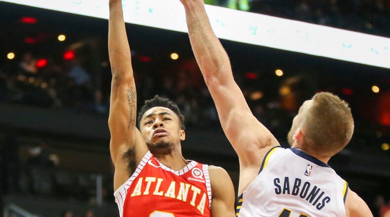 Atlanta Hawks guard Jaylen Morris (3) shoots the ball over Indiana Pacers center Domantas Sabonis (11) in the first half of an NBA basketball game, Wednesday, Feb. 28, 2018, in Atlanta. (AP Photo/Brett Davis)