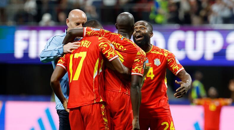 Congo's Cedric Bakambu (17), Yoane Wissa (20) and Gedeon Kalulu (24) celebrate a win during the World Cup Group K soccer match between DR Congo and Uzbekistan in Atlanta, Saturday, June 27, 2026. (AP Photo/Erik S. Lesser)