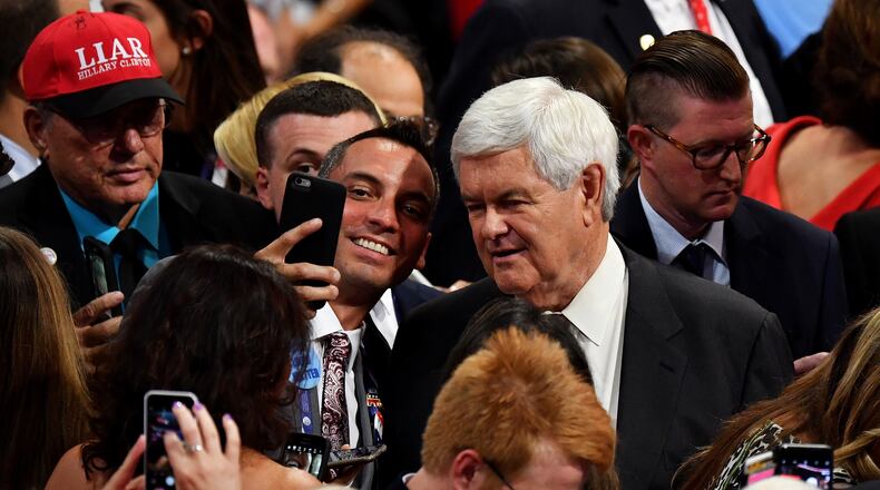 CLEVELAND, OH - JULY 21: Former Speaker of the House Newt Gingrich (R) poses for a selfie on the fourth day of the Republican National Convention on July 21, 2016 at the Quicken Loans Arena in Cleveland, Ohio. Republican presidential candidate Donald Trump received the number of votes needed to secure the party's nomination. An estimated 50,000 people are expected in Cleveland, including hundreds of protesters and members of the media. The four-day Republican National Convention kicked off on July 18. (Photo by Jeff J Mitchell/Getty Images)