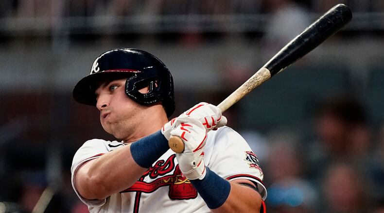 Atlanta Braves' Austin Riley follows though on a two-run single during the third inning of the team's baseball game against the New York Mets on Wednesday, June 30, 2021, in Atlanta. (AP Photo/John Bazemore)