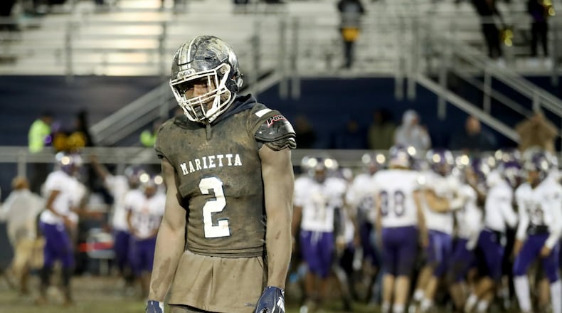 Marietta defensive end Arik Gilbert (2) reacts after the loss to East Coweta. (Jason Getz/Special)