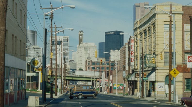 By about 1980, when this photo was taken, Interstate 75/85, the green bridge in the distance, had separated Sweet Auburn from downtown Atlanta. (Cotten Alston, courtesy of the Kenan Research Center at the Atlanta History Center.)