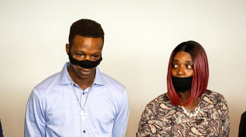 Tywouna Walker (R) stands next to her son Roderick Walker as he talks to the press during a press conference in Atlanta, September 18, 2020. STEVE SCHAEFER / SPECIAL TO THE AJC