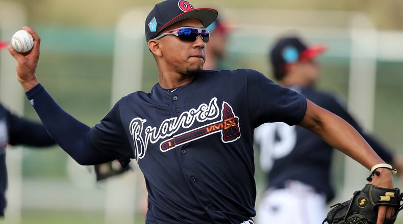 Johan Camargo loosens his arm during spring training on Monday, Feb 19, 2018, at the ESPN Wide World of Sports Complex in Lake Buena Vista. Curtis Compton/ccompton@ajc.com