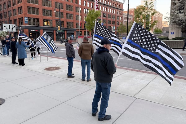 Christopher Schurr supporters stand outside the Kent County Courthouse in Grand Rapids, Mich., Monday, April 28, 2025. (Neil Blake/The Grand Rapids Press via AP)