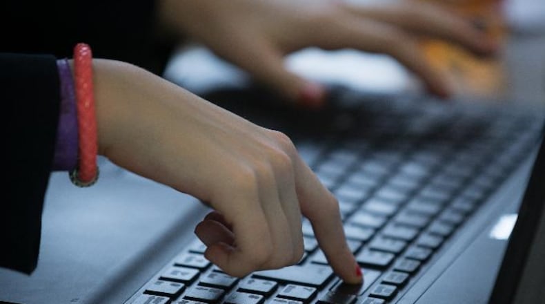File photo of a child using a computer. (Photo by Matt Cardy/Getty Images)