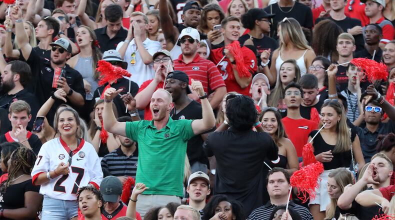 A Notre Dame fan finds himself surrounded by Georgia fans.  Curtis Compton/ccompton@ajc.com