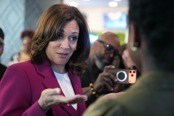 Former Vice President Kamala Harris speaks with a girl at Crave restaurant ahead of a South Carolina Democratic Party fundraiser in South Carolina earlier this month. (Meg Kinnard/AP)