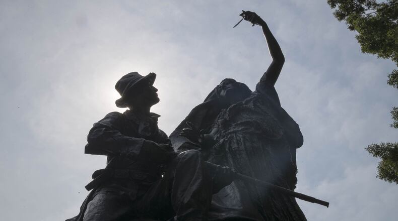 The “Peace Monument” in Atlanta’s Piedmont Park depicts an angel staying the hand of a Confederate soldier as he holds a rifle. In her other hand, the angel holds an olive branch.