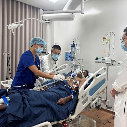 An Indian tourist, who was rescued from a speedboat that capsized, receives treatment at a hospital in Phu Quoc, Vietnam, Saturday, July11, 2026. (Le Huy Hai/VNA via AP)
