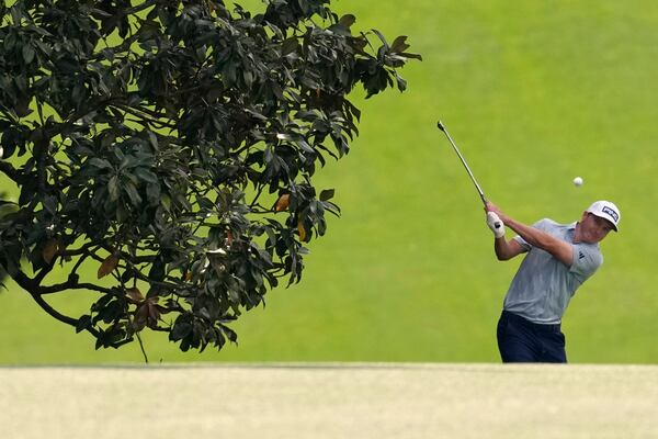 Matt McCarty hits from the fairway on the 18th hole during the second round at the Masters golf tournament, Friday, April 11, 2025, in Augusta, Ga. (AP Photo/George Walker IV)