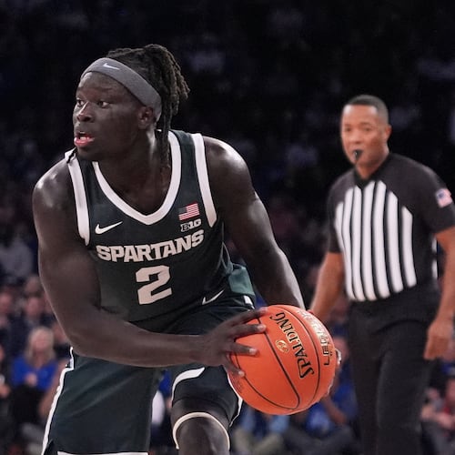 Michigan State's Kur Teng (2) looks to pass during the second half of an NCAA college basketball game against Kentucky Tuesday, Nov. 18, 2025, in New York. (AP Photo/Frank Franklin II)