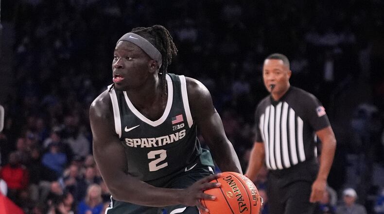 Michigan State's Kur Teng (2) looks to pass during the second half of an NCAA college basketball game against Kentucky Tuesday, Nov. 18, 2025, in New York. (AP Photo/Frank Franklin II)