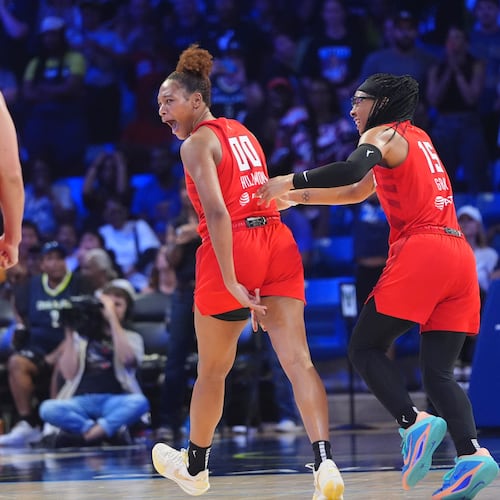 Atlanta Dream forward Naz Hillmon (00) celebrates hitting a game winning shot with teammates guard Allisha Gray (15) and forward Brionna Jones (24) during the second half of a WNBA basketball game against the Dallas Wings in Arlington, Texas, Wednesday, July 30, 2025. (AP Photo/LM Otero)