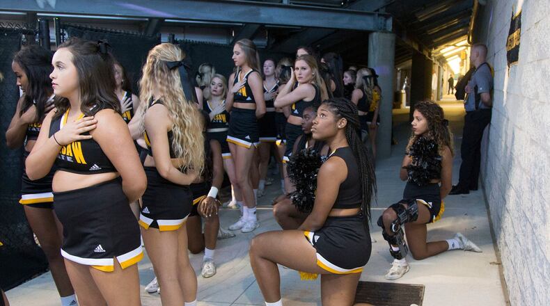 Several Kennesaw State cheerleaders took a knee at a football game in what they said was an act of protest against racism and inequality.
