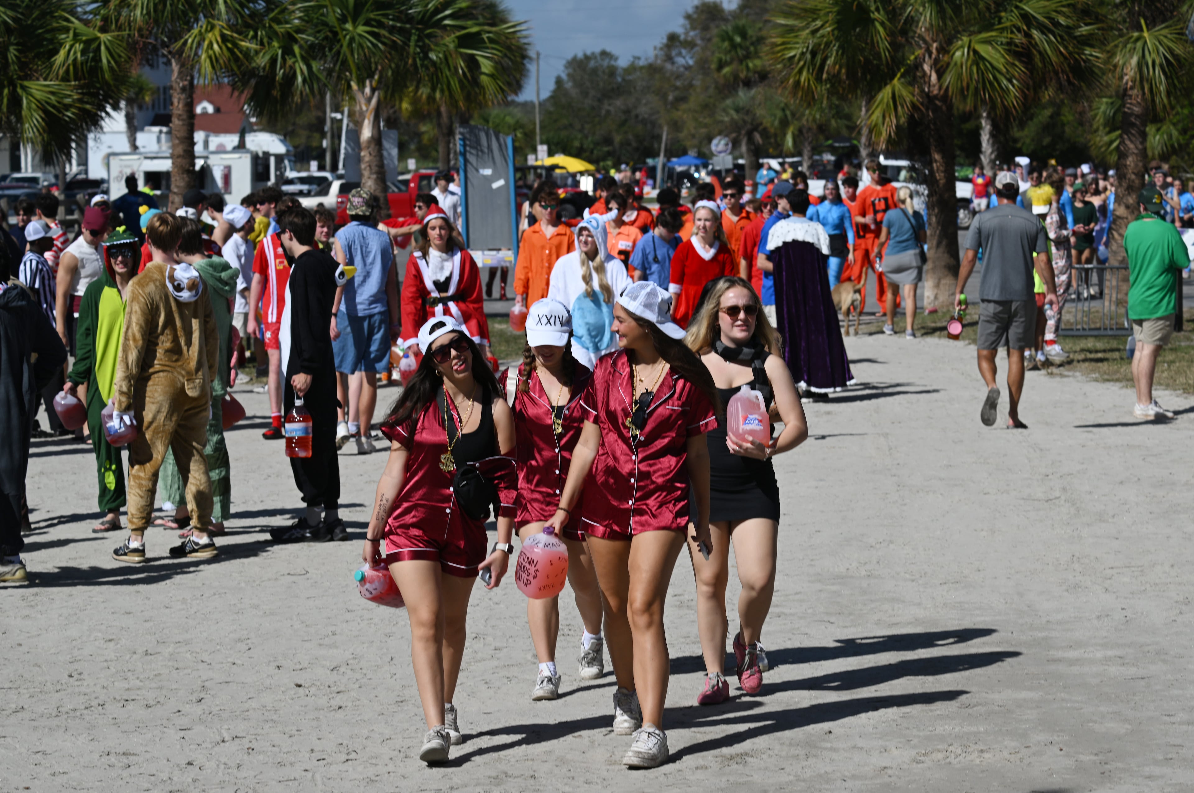 UGA students with Halloween costumes arrive for the annual “Frat Beach” party to celebrate before the annual Georgia-Florida football game on St. Simons Island, Friday, November 1, 2024. On the weekend of the Georgia-Florida football game, St. Simons Island’s East Beach becomes “Frat Beach,” an open-air party teeming with thousands of college students. (Hyosub Shin / AJC)