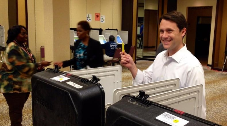 Democrat Jason Carter casts his ballot in Atlanta on Wednesday. AJC/Jeremy Redmon