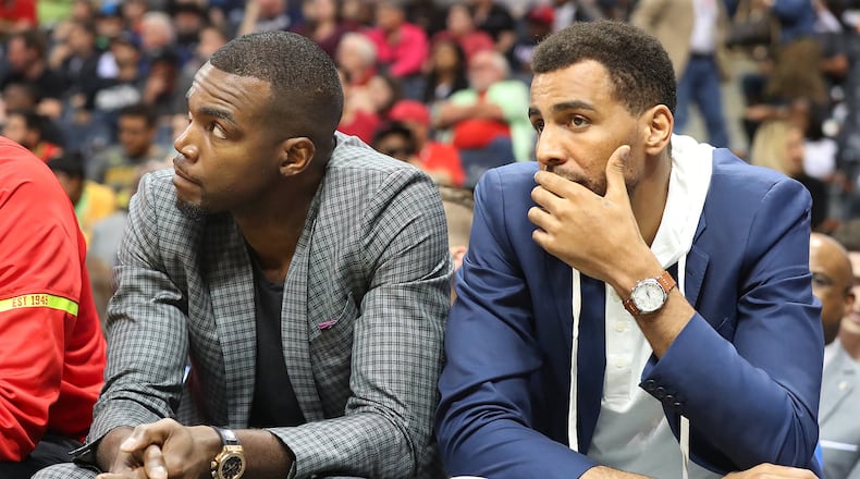 Paul Millsap (left) and guard Thabo Sefolosha watch from the bench as the Hawks fall 107-92 to the Brooklyn Nets in a NBA basketball game on Sunday, March 26, 2017, in Atlanta. Curtis Compton/ccompton@ajc.com