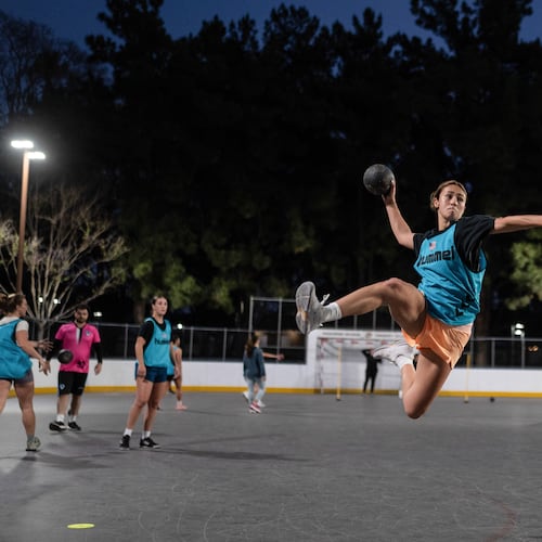 Devyn Holbrook takes a jump shot during a handball training session in Tustin, Calif., Wednesday, March 25, 2026. (AP Photo/Jae C. Hong)
