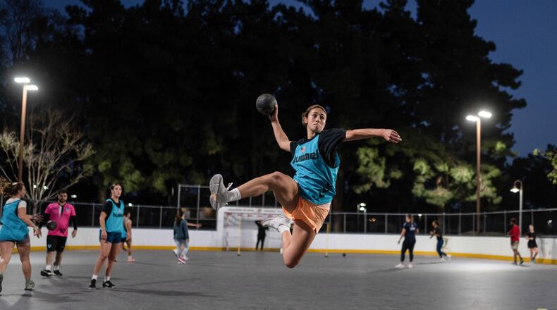 Devyn Holbrook takes a jump shot during a handball training session in Tustin, Calif., Wednesday, March 25, 2026. (AP Photo/Jae C. Hong)