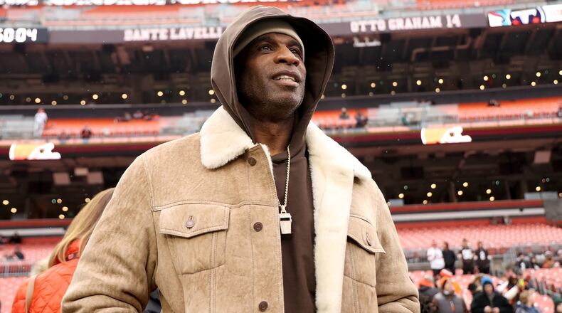 FILE - University of Colorado head coach Deion Sanders stands on the sidelines prior to the start of an NFL football game between the Cleveland Browns and the Tennessee Titans, Sunday, Dec. 7 2025, in Cleveland. (AP Photo/Kirk Irwin, File)