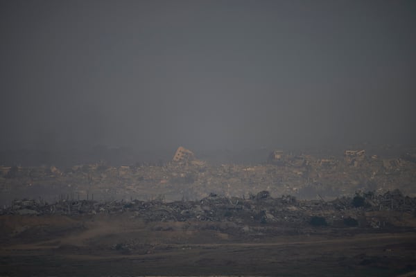 Destroyed buildings in the Gaza Strip are seen from a southern Israel location on Sunday, July 13, 2025. (AP Photo/Ohad Zwigenberg)