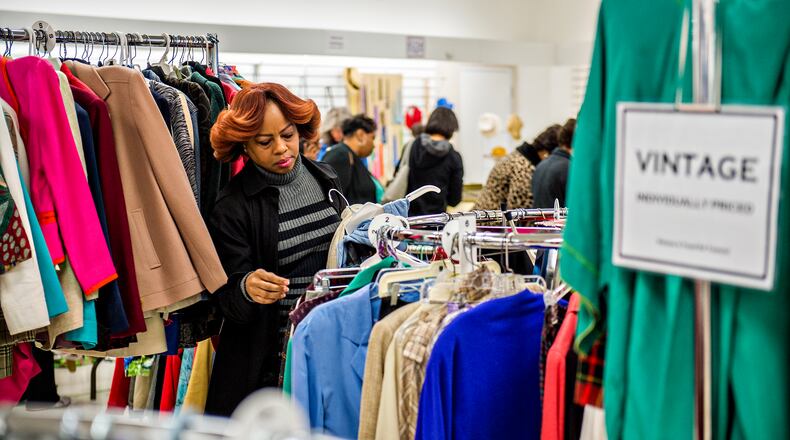 Sandy Springs - Ruth Hayes shops for vintage clothes during the Sandy Springs Society Tossed Out Treasures sale at Marshall's Plaza in Sandy Springs in 2016. Proceeds from the sale support nonprofit organizations within the community. JONATHAN PHILLIPS / SPECIAL