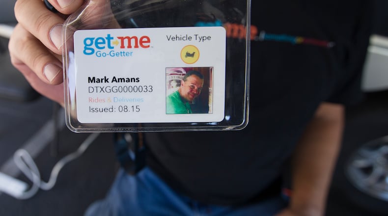 Get Me Rides & Deliveries employee Mark Amans holds up his badge. All of Get me Drivers will have to have a badge like this one in order to work for the company. Dallas-based Get Me is the latest app-based, on-demand ride and Delivery Company to launch in Austin, Texas.(RICARDO B. BRAZZIELL / AMERICAN-STATESMAN)