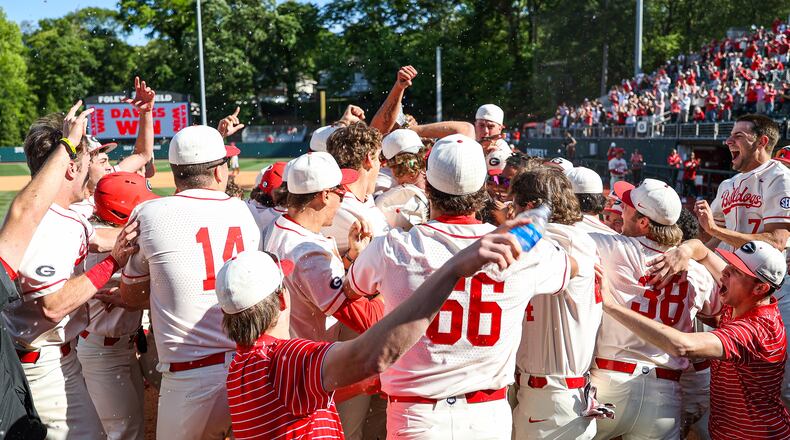 Somewhere within that home-plate mob of Georgia Bulldogs is Parks Harber, whose solo home run followed Connor Tate's grandslam and completed a five-run ninth for an incredible 9-8 walkoff win over No. 5 Arkansas at Foley Field in Athens on Saturday. (Kari Hodges/UGA Athletics)