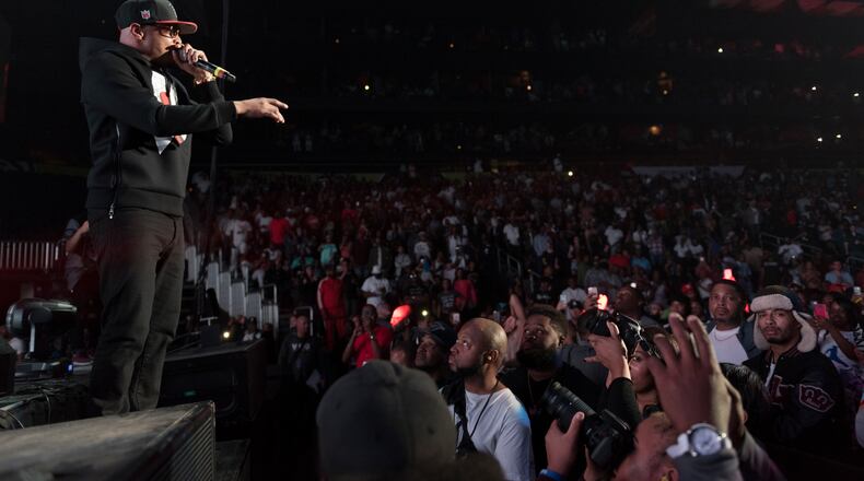 T.I. addresses the Philips Arena crowd at Saturday's V-103 "Pop Up Live" concert. (DAVID BARNES / DAVID.BARNES@AJC.COM)