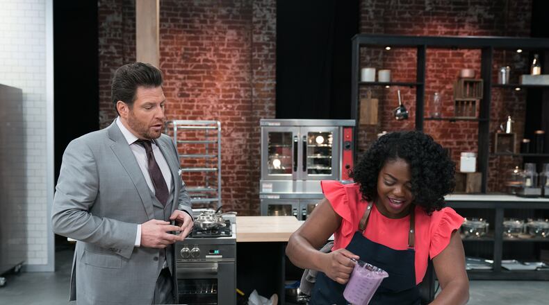 Host Scot Contant (L) and Contestant Lasheeda Perry during the Skills Challenge, Cake, Glorious Cake, Make One Dozen Decorated Petits Fours, as seen on Best Baker in America, Season 2.
