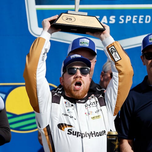 Tyler Reddick celebrates in Victory Lane after winning a NASCAR Cup Series auto race at Kansas Speedway in Kansas City, Kan., Sunday, April 19, 2026. (AP Photo/Colin E. Braley)