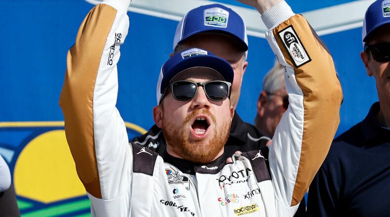 Tyler Reddick celebrates in Victory Lane after winning a NASCAR Cup Series auto race at Kansas Speedway in Kansas City, Kan., Sunday, April 19, 2026. (AP Photo/Colin E. Braley)