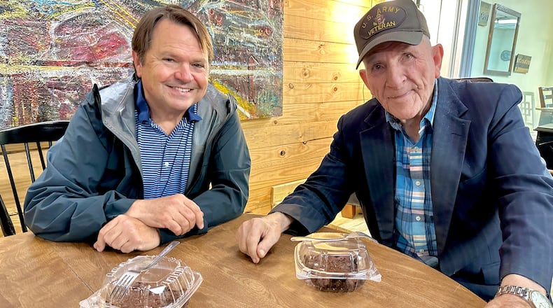 McCracken Poston (left) and Alvin Ridley earlier this year in a Ringgold coffee shop that once housed Ridley's TV repair business. Poston and Ridley formed a friendship 25 years ago when Poston successfully defended Ridley on a murder charge.