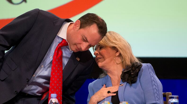 Reince Priebus, chairman of the Republican National Committee, left, speaks with co-chair Sharon Day during an RNC meeting earlier this year. AP/Wilfredo Lee