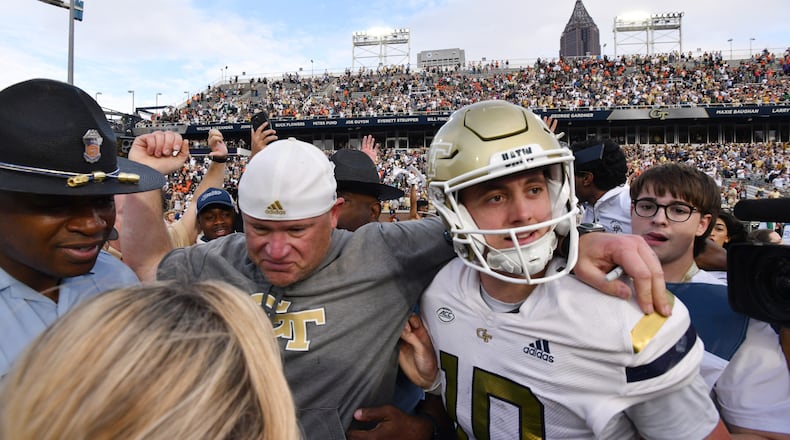 Georgia Tech coach Brent Key and quarterback Haynes King (10) celebrate after defeating Miami in an NCAA college football game at Georgia Tech's Bobby Dodd Stadium, Saturday, November 9, 2024, in Atlanta. Tech won 28-23 over Miami. (Hyosub Shin / AJC)
