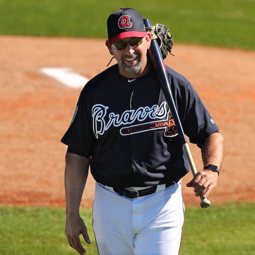 Hi-ho, hi-ho, Braves bench coach Walt Weiss and the tools of his trade report to another day of work at spring training. (Curtis Compton/AJC)